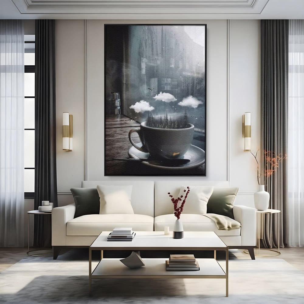 Tablou canvas cu ceasca de cafea cu padure si nori, in rama de aluminiu negru, pe perete intr-un living